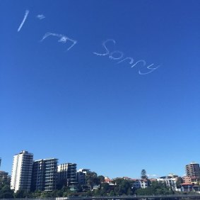 "I'm sorry" appears over Brisbane.