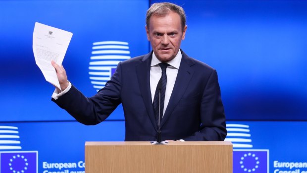 European Council President Donald Tusk shows the six-page letter handed to him by the UK's permanent representative to the EU, triggering Article 50. 