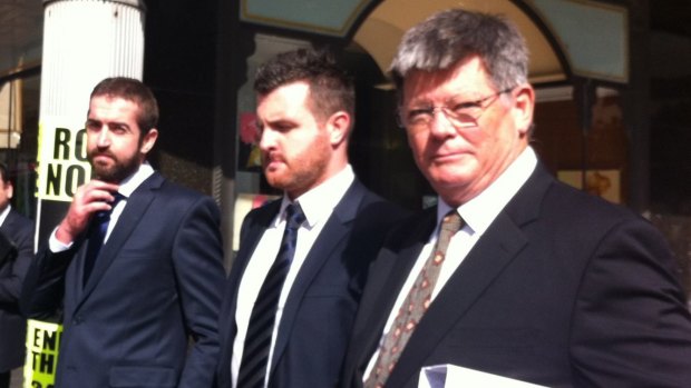 Brothers Patrick Lyttle (left), Barry Lyttle (centre) and barrister Chris Watson outside court on Thursday.