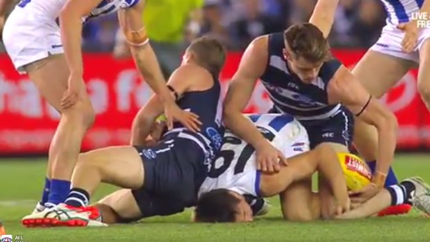 Joel Selwood applies his controversial "chicken wing" tackling technique.