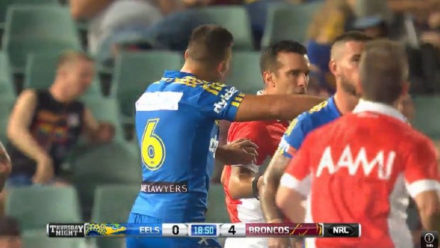 Corey Norman makes contact with referee Matt Checcin in Parramatta's round one loss to the Broncos.