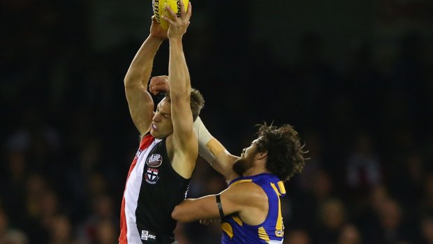 St Kilda's Sean Dempster marks in front of West Coast's Josh Kennedy