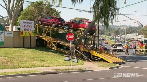 The scene where a car-carrier ran into a power pole before crashing into a childcare centre at Ferntree Gully on Thursday.