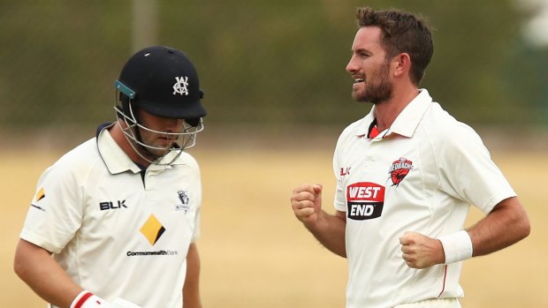 Over and out: Redbacks paceman Chadd Sayers celebrates taking the wicket of Aaron Finch.