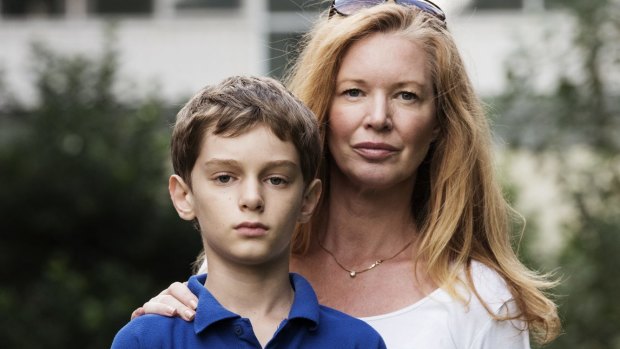 Janine Barrett with her 11-year-old son, Fred, outside Ultimo Public School.  They intend to leave Sydney for a country high school.