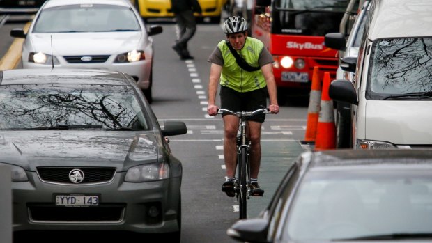 Under a new road rule, motorists would have to keep a one-metre buffer between their car and cyclists.