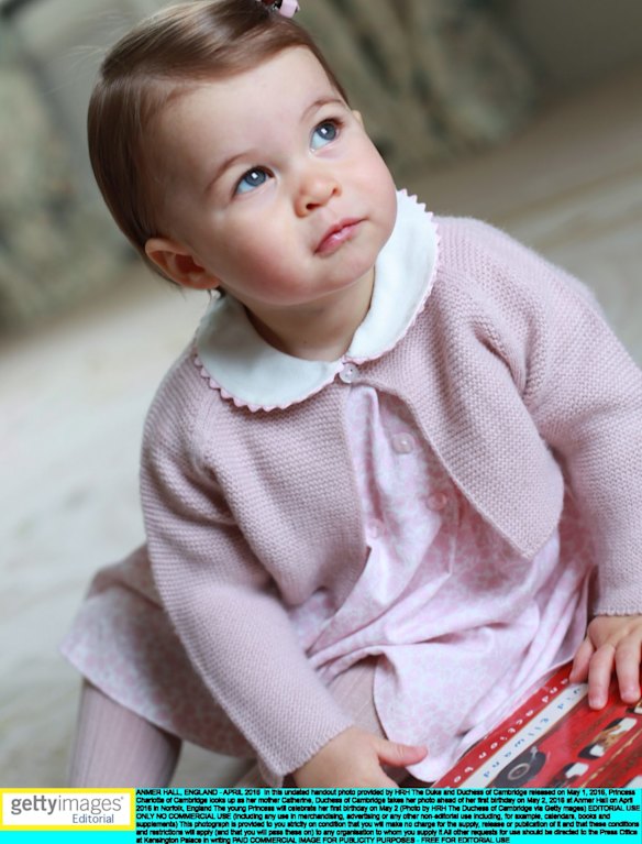 Princess Charlotte looks up as her mother Catherine, Duchess of Cambridge takes her photo ahead of her first birthday.