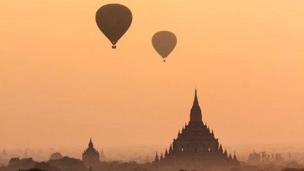 Hot-air balloons at a temple, Bagan.