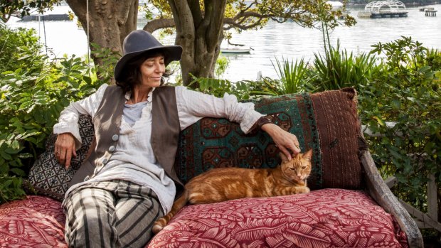 “Our cat is called Van, after Van Morrison, and his favourite spot is sitting next to me on this comfortable hardwood bench from New Guinea.” The bench’s fabric is by Bruce Goold.