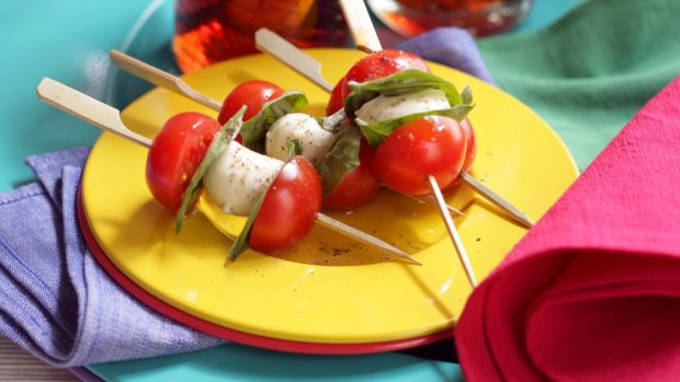 Caprese skewers with cherry tomatoes.
