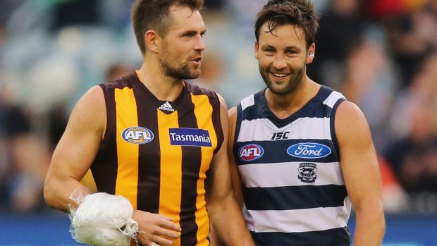 Walking wounded:  Luke Hodge chats with Geelong's Jimmy Bartel.