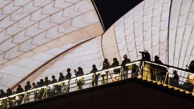 People wait for the start of Vivid on the Opera House in 2017.