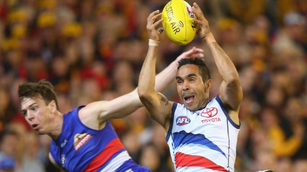 Adelaide's five-goal hero Eddie Betts marks in front of Liam Picken of the Bulldogs.