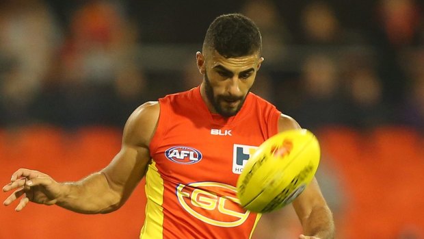 GOLD COAST, AUSTRALIA - MAY 09:  Adam Saad of the Suns kicks during the round six AFL match between the Gold Coast Suns and the Adelaide Crows at Metricon Stadium on May 9, 2015 in Gold Coast, Australia.  (Photo by Chris Hyde/Getty Images)
