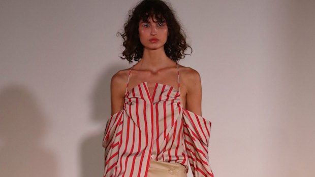 Off-the-shoulder shirting at Christopher Esber. 