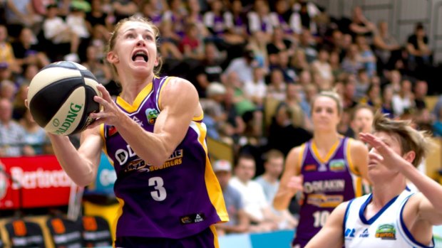 Melbourne Boomers' Brittany Smart drives to the hoop against Canberra's Jess Bibby.