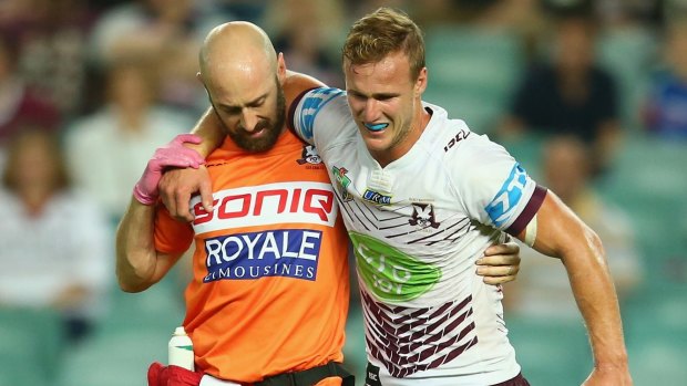 Daly Cherry-Evans limps off the Allianz Stadium turf in March.