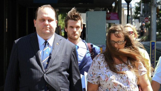 Scott Driscoll and wife Emma Driscoll on their way to the Brisbane District Court this week.