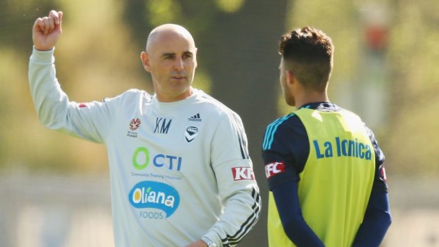 Aim high: Victory coach Kevin Muscat talks with Kosta Barbarouses.
