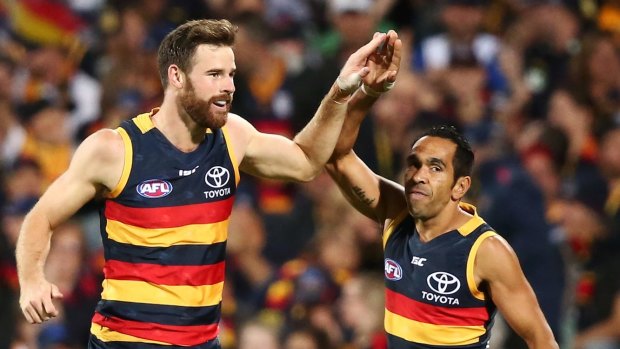 Back in full flight: Andy Otten celebrates a goal with fellow Crows forward Eddy Betts.