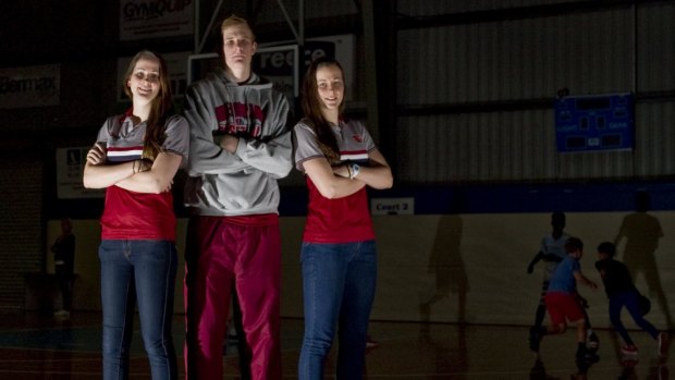 Canberra Capitals recruit Keely Froling, left, with sister Alicia and brother Harry.