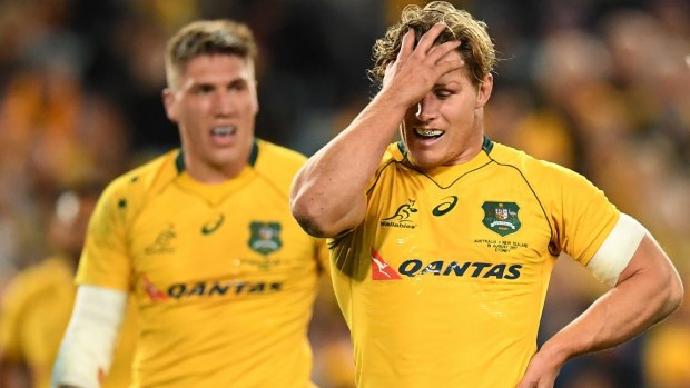 Tough night: Skipper Michael Hooper reacts to another All Blacks try.