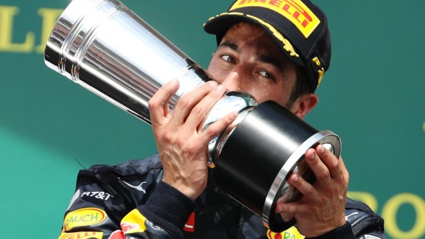 Daniel Ricciardo of Australia and Red Bull Racing with his second-place trophy at the German Grand Prix in Hockenheim.