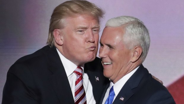 Republican Presidential Candidate Donald Trump, air kisses his running mate  Mike Pence after Pence's acceptance speech on Wednesday.