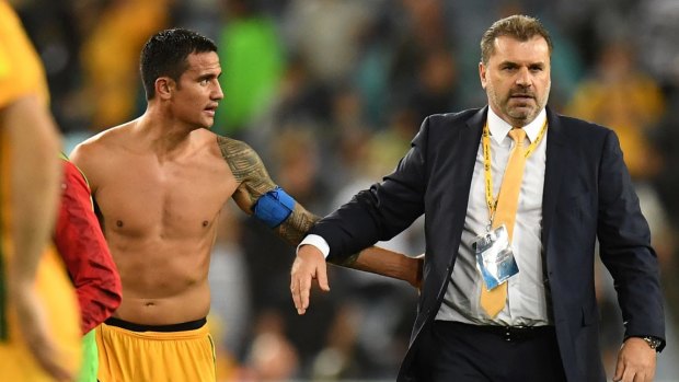 Distraction: Tim Cahill and Ange Postecoglou after the win over Syria.