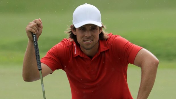 Aaron Baddeley sizes up the first playoff hole.