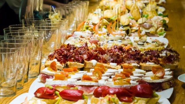 Spanish snacks (pintxos) on the counter of a tapas bar in  San Sebastian.