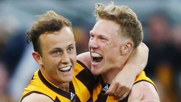 Double delight: Hawks Billy Hartung celebrates a goal with James Sicily.
