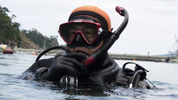 Yasuo Takamatsu after a dive in search of his wife, Yuko. “I have no choice but to keep looking for her. I feel closest to her in the ocean.”