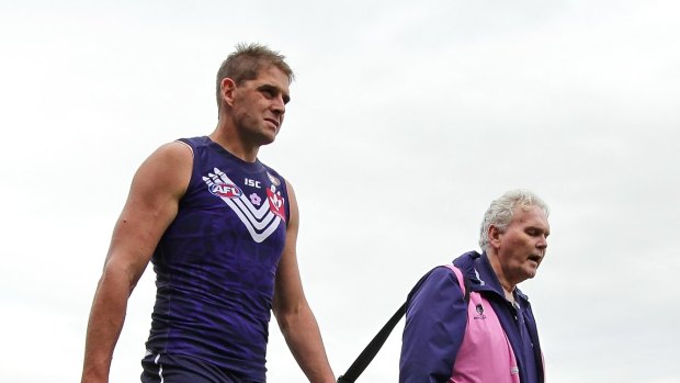 Aaron Sandilands leaves with a suspected hamstring injury.