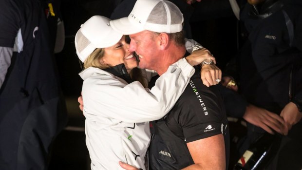 Kelly Landry and Anthony Bell embrace at Constitution Dock after he claimed line honours in the 2016 Sydney to Hobart Yacht Race.