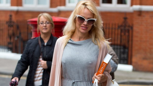 Pamela Anderson delivers lunch to Julian Assange at the Embassy of Ecuador in October last year.