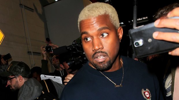 Kanye West (and his new bleached blonde 'do) leaves the Yeezy show fashion during New York Fashion Week.
