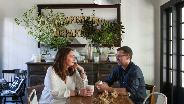 The couple sit at the dining table in front of a 300 year-old kitchen chest. “It’s the patina, honesty and integrity that I love,” says Leanne