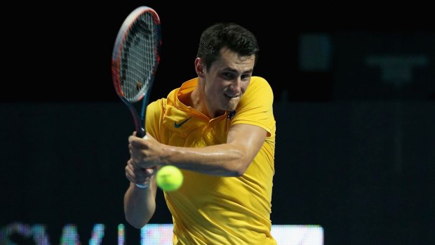 Streamlined: Bernard Tomic plays a backhand during the Fast4 International Exhibition match against Dominic Thiem.