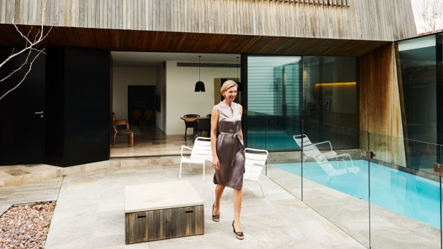 The striking modern extension at the rear of the block opens onto a central courtyard and pool. “We selected spotted gum timber as it’s economical and environmentally sustainable, and ages to a beautiful silver,” says Rosa, pictured.