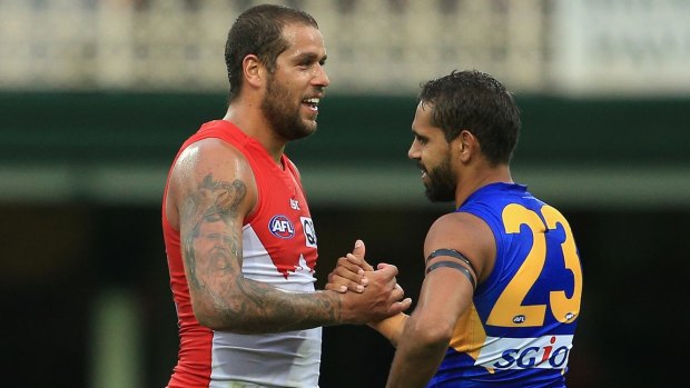 Frenemies: Lance Franklin and former teammate Lewis Jetta embrace following the round five match between the Sydney Swans and the West Coast Eagles at the Sydney Cricket Ground.