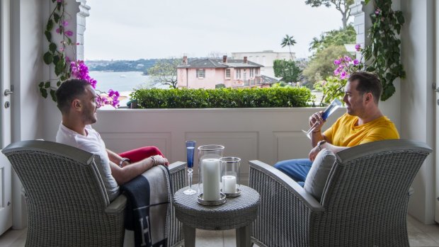The balcony has stunning views over Sydney Harbour. “We love sitting out here on Sunday mornings, having coffee and looking out,” says Ben.
