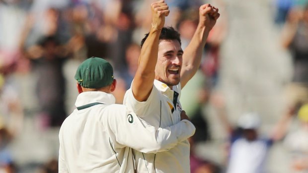 All over: Mitchell Starc celebrates after the final wicket. 