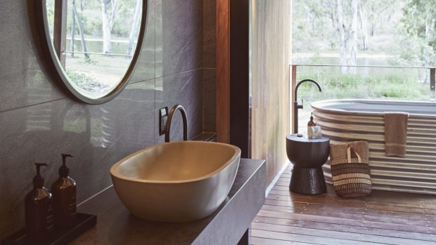All rooms come with a private outdoor bathtub, fashioned from corrugated iron.