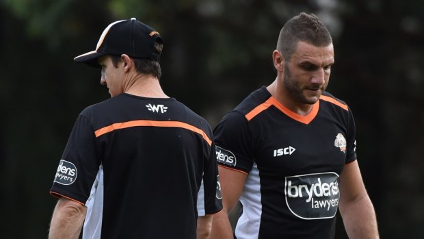 We good? Robbie Farah, right, and coach Jason Taylor crossing paths at a training session. 