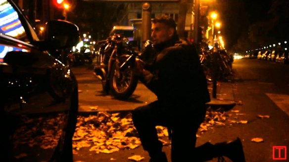 A policeman shelters during the gun battle.
