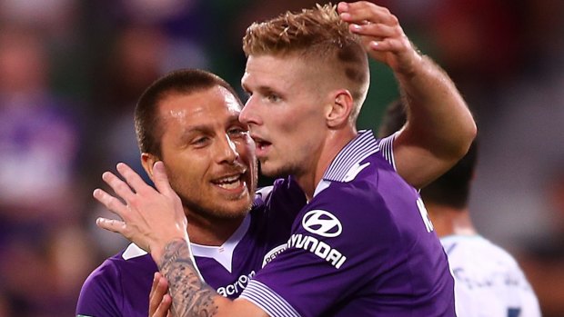 Glorious: Nebojsa Marinkovic and Andy Keogh celebrate a Perth goal against Melbourne Victory.