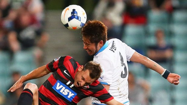 New addition: Yusuke Tanaka of Kawasaki Frontale challenges Wanderers opponent Brendon Santalab during the AFC Asian Champions League match at Pirtek Stadium last March.