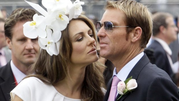 Brand ambassadors: Liz Hurley with Shane Warne.
