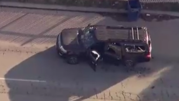 The suspects' SUV on the street.
